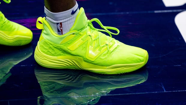 View of green New Balance shoes.